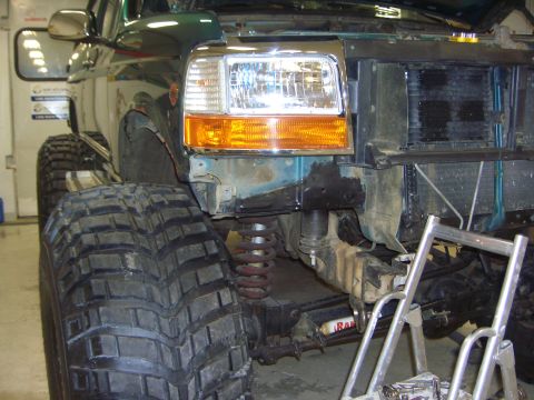 1996 Ford Bronco - This modified Ford Bronco shows its front end disassembled, revealing the radiator and suspension components.