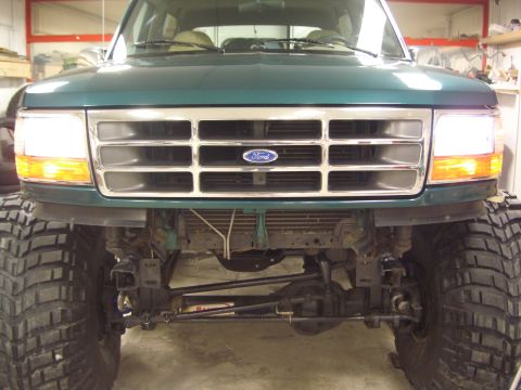 1996 Ford Bronco - Front view of a 1996 Ford Bronco showing its grille, headlights, and oversized tires.