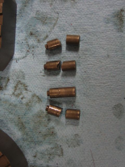 1996 Ford Bronco - Several small metal pins are laid out on a blue shop towel, likely for a vehicle repair.