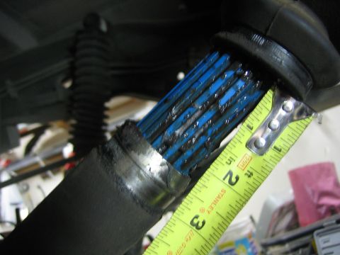 1996 Ford Bronco - A close-up view shows a driveshaft with blue splines being measured with a tape measure.