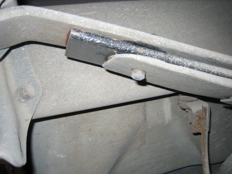 1996 Ford Bronco - A close-up view of a vehicle's rear suspension component, highlighting its construction and wear.