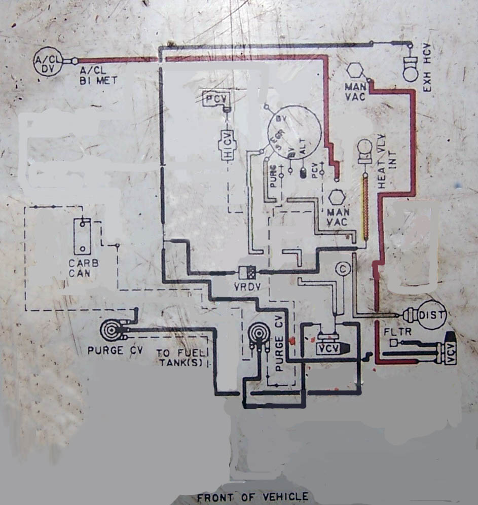 Faded engine vacuum routing diagram label on metal