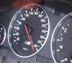 1996 Ford Probe - The dashboard shows a speedometer and tachometer with an M logo, indicating a performance-oriented vehicle.