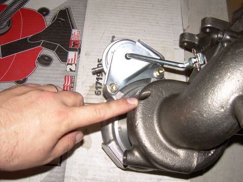 1996 Ford Probe - A turbocharger part is shown, with a finger indicating a specific area. Part number 617195 is visible.