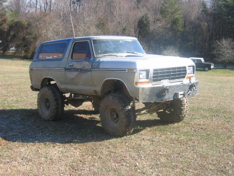 1992 Ford Mustang - This modified Ford Bronco features a lifted suspension and oversized tires, giving it a off-road appearance.
