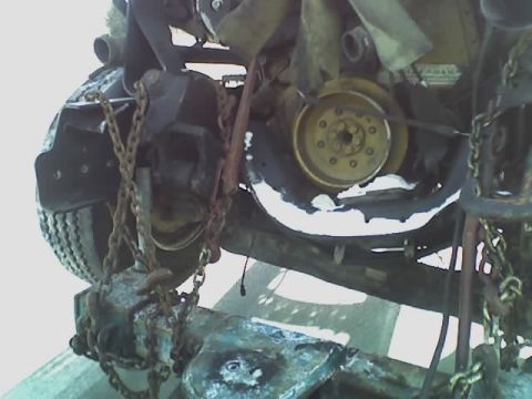 1992 Ford Bronco - Close-up of engine components and chains, likely from a vehicle undergoing repair or disassembly.