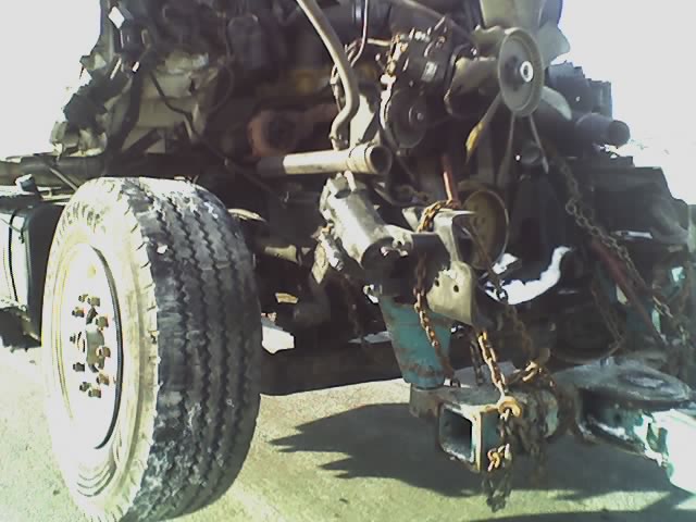 Damaged engine and front tire with chains