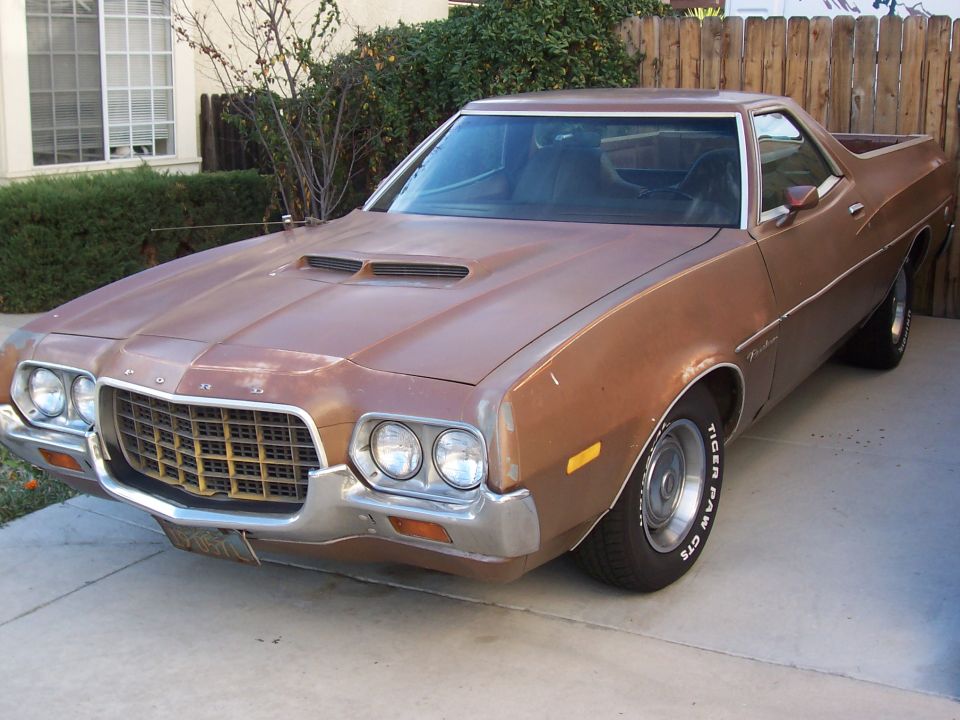 Brown 1972 Ford Ranchero with a prominent hood scoop and grille