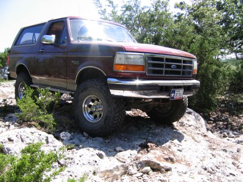 1996 Ford Bronco - 1996 Ford Bronco navigating rocky terrain.