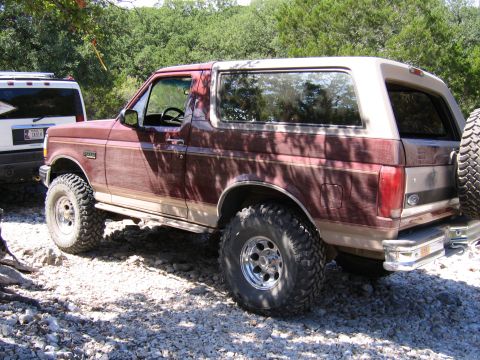 1996 Ford Bronco - This 1996 Ford Bronco is shown from a three-quarter front view, parked off-road.