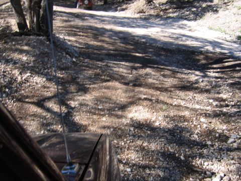 1996 Ford Bronco - Dirt road scene with a red ATV visible in the background.