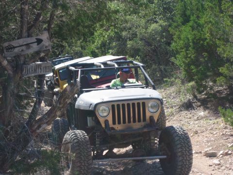 1996 Ford Bronco - Off-road Jeeps navigate a wooded trail near Zachary's Creek.