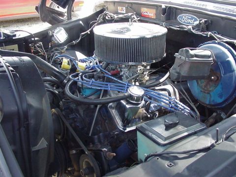 1979 Ford Bronco - Engine bay of a Ford vehicle, showing the V8 engine and various components.