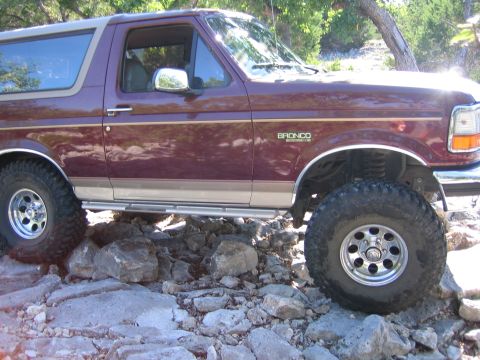 1996 Ford Bronco - This 1996 Ford Bronco is shown off-roading over a rocky surface.
