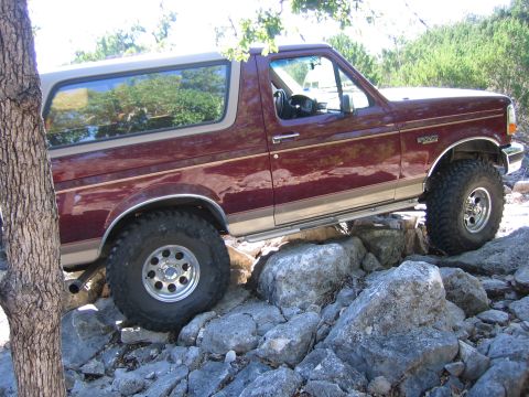 1996 Ford Bronco - This 1996 Ford Bronco navigates a challenging rocky path, its off-road capabilities.