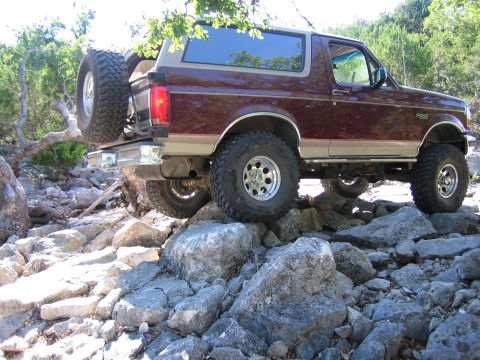 1996 Ford Bronco - 1996 Ford Bronco tackling a challenging rocky trail.