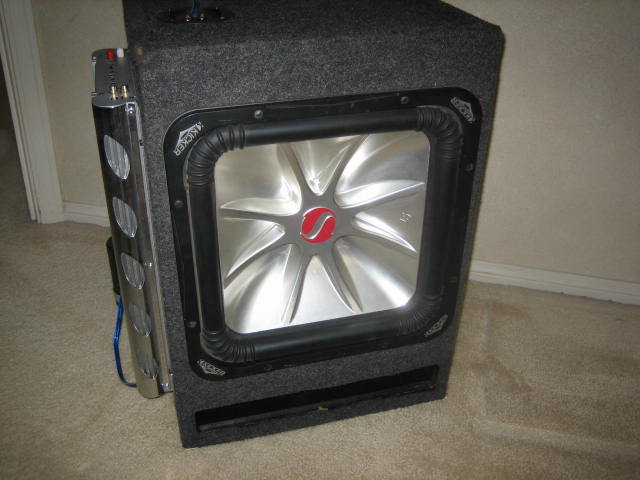 Subwoofer box with Kicker logo and silver cone