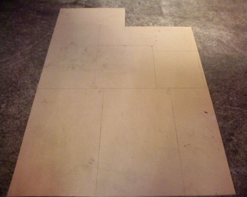 1995 Ford Bronco - Cardboard pieces marked with a grid pattern on a concrete floor.