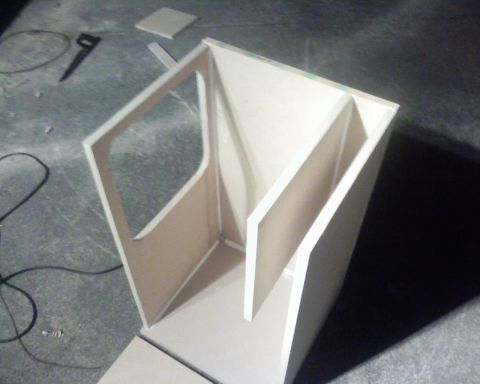 1995 Ford Bronco - A custom speaker box is being constructed, showing the internal bracing and cutouts for speaker mounting.