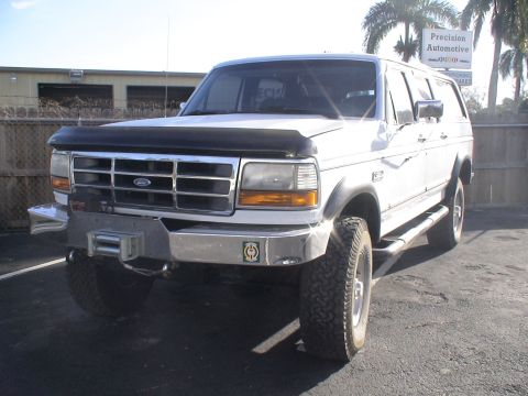 1993 Ford C-350 (Centurion Conversions) - This Ford Bronco has a custom front bumper with a winch, and side steps.