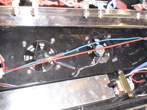 1993 Ford C-350 (Centurion Conversions) - The image shows internal electronic components, including two cooling fans and associated wiring.