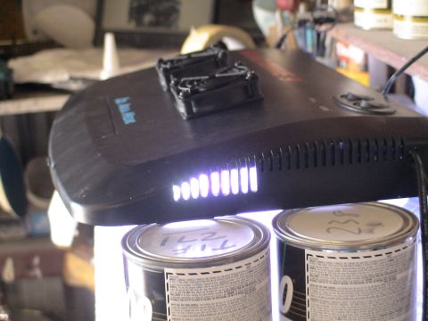 1993 Ford C-350 (Centurion Conversions) - A black lamp with purple indicator lights is positioned above two paint cans, one labeled TIF 271 and the other 239.