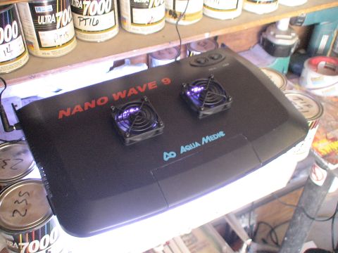 1993 Ford C-350 (Centurion Conversions) - The Aqua Medic Nano Wave 9 aquarium light features two cooling fans and purple LEDs, sitting amongst paint cans.