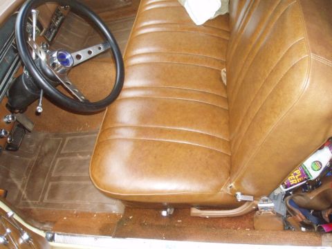 1970 Ford Ranchero - The interior of a 1970 Ford Ranchero shows brown vinyl seats and an aftermarket steering wheel.