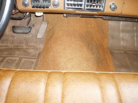 1970 Ford Ranchero - Interior view of a 1970 Ford Ranchero, showing the dashboard, pedals, and seating.
