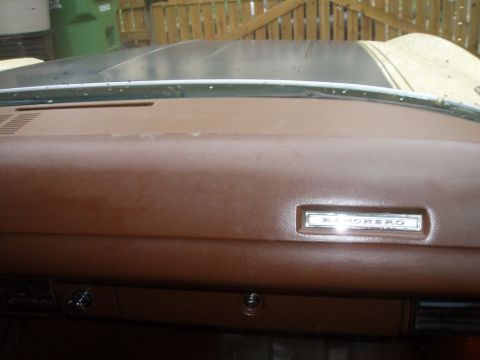 1970 Ford Ranchero - Interior view of a 1970 Ford Ranchero, showing the dashboard and a prominent 'RANCHERO' badge.
