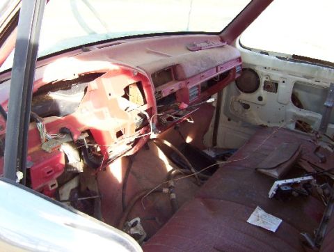 1992 Lincoln Custom - Interior view of a car showing a disassembled dashboard and exposed wiring.