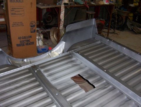 1992 Lincoln Custom - The bare metal truck bed appears to be undergoing some form of modification or repair.