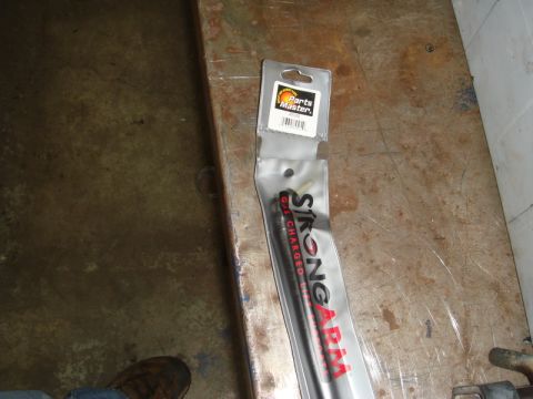 1996 Ford Bronco - A gas charged lift support part is shown in its original packaging.