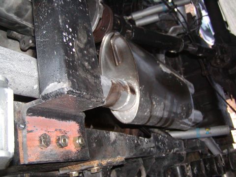 1991 Ford Bronco - Undercarriage view showing the exhaust system and suspension components, including a Bilstein shock absorber.