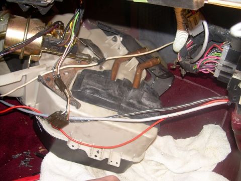1989 Lincoln Town Car - Disassembled heater core unit with exposed wiring and plumbing components.