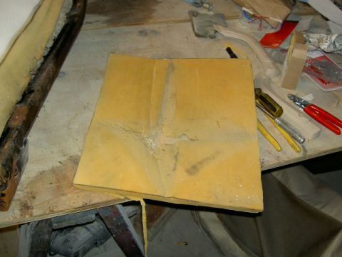 1967 Ford Ranchero - A piece of yellow foam padding lies on a workbench next to various tools.