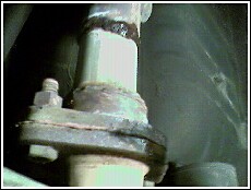 1996 Ford Probe - This image shows a close-up view of a vehicle's driveshaft connection point.
