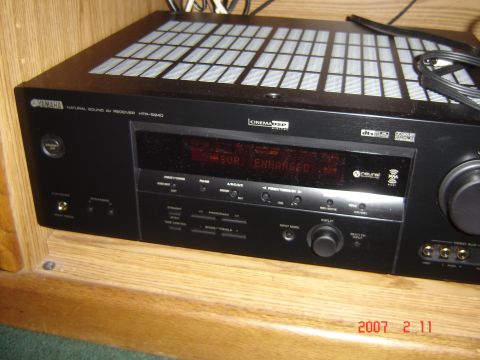 1993 Ford Bronco - A Yamaha Natural Sound AV Receiver HTR-5940 is shown in a wooden cabinet.