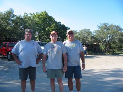 1996 Ford Bronco - Three men pose for a photo outdoors with two SUVs visible in the background.