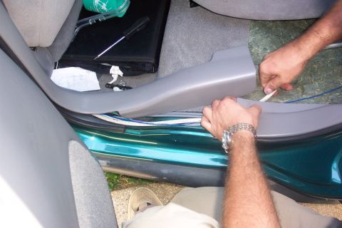 1998 Ford Taurus - back seat pulled out and up...wiring ran under sill and seat