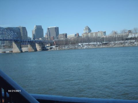 1995 Ford Probe - A view of a city skyline and bridge over a river on a clear day.