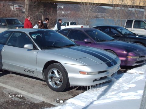 1995 Ford Probe - Silver 1995 Ford Probe GTS with racing stripes and icicles hanging from the front bumper.