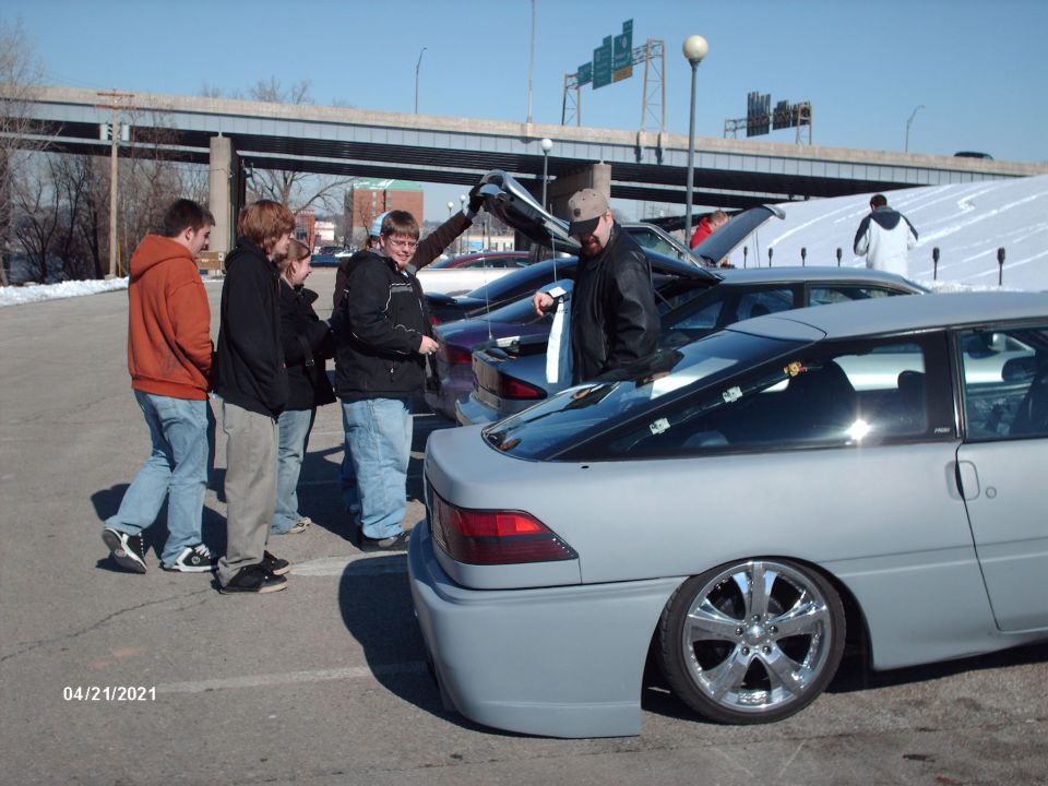 Gray coupe rear view, custom wheels