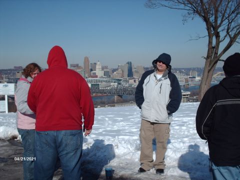 1995 Ford Probe - A group of people stand in a snowy area overlooking a city skyline, with the date 04/21/2021 visible in the corner.