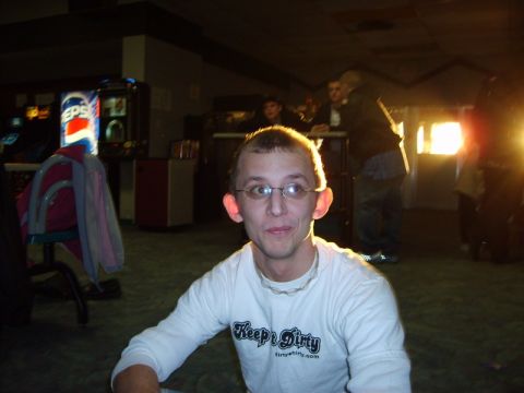 1995 Ford Probe - Man wearing glasses and a white long-sleeved shirt with text in an indoor setting.