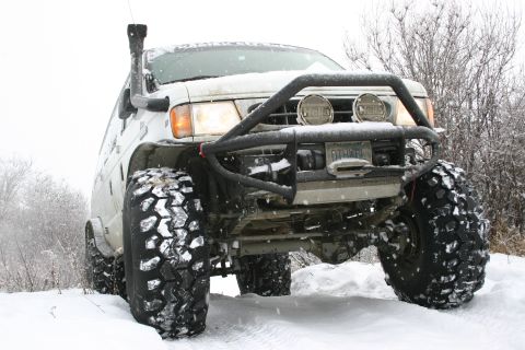 2003 Jeep TJ - This heavily modified van is equipped for extreme off-road conditions, large tires and a snorkel for deep water crossings.