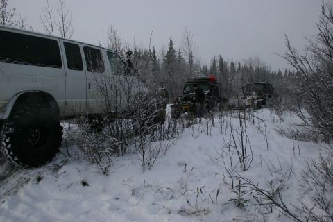 2003 Jeep TJ - Several off-road vehicles are stuck in the snow during a winter excursion.