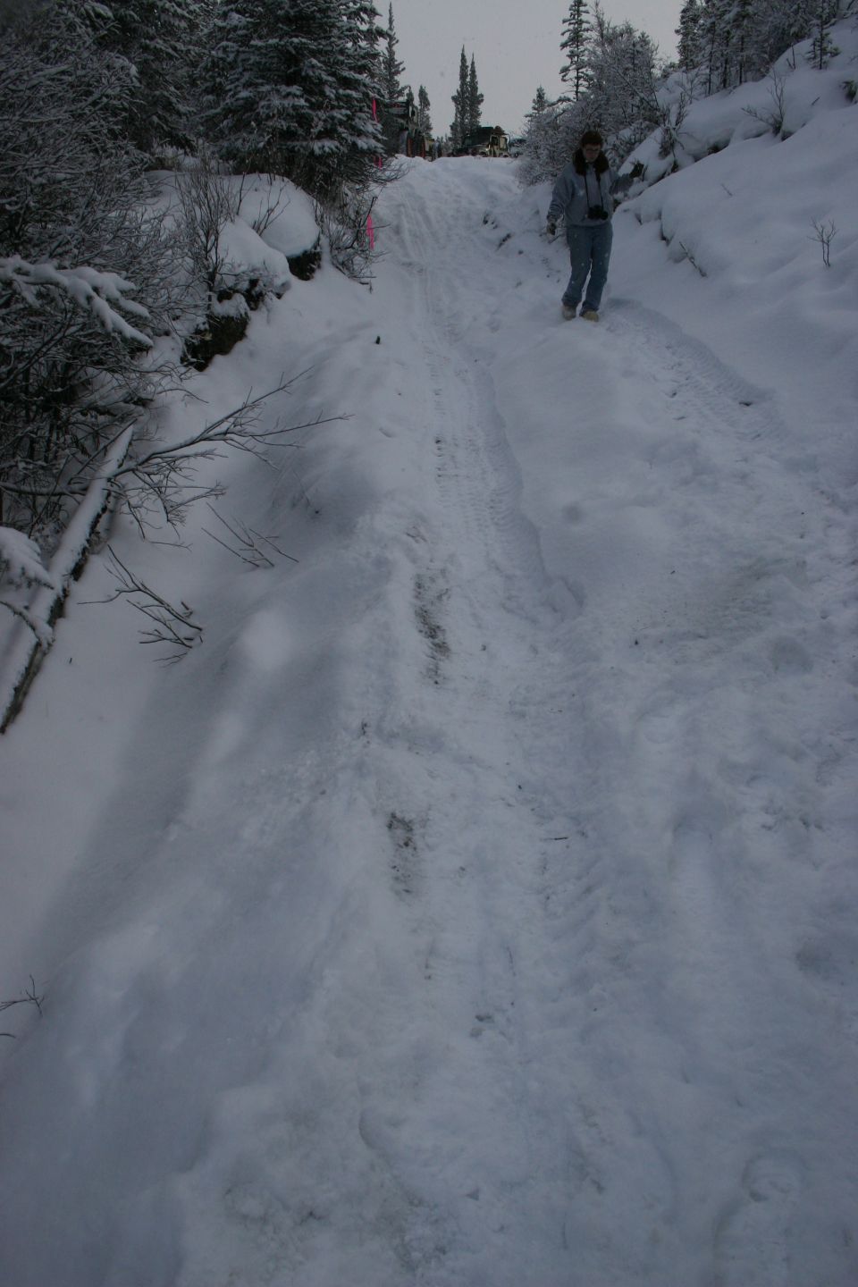 Person on a snowy trail in the mountains