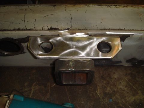 1996 Ford Bronco - Custom metal bracket welded onto a vehicle's rear bumper, showing repair work.