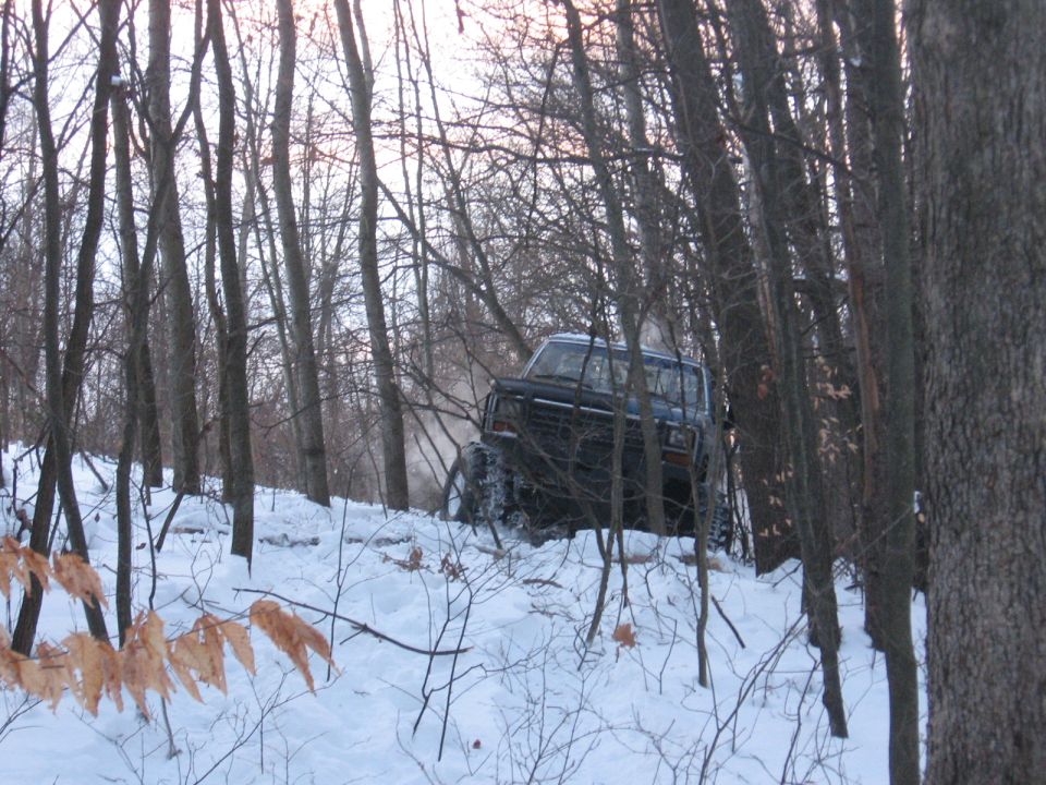 1979 Ford Bronco navigating snowy woods